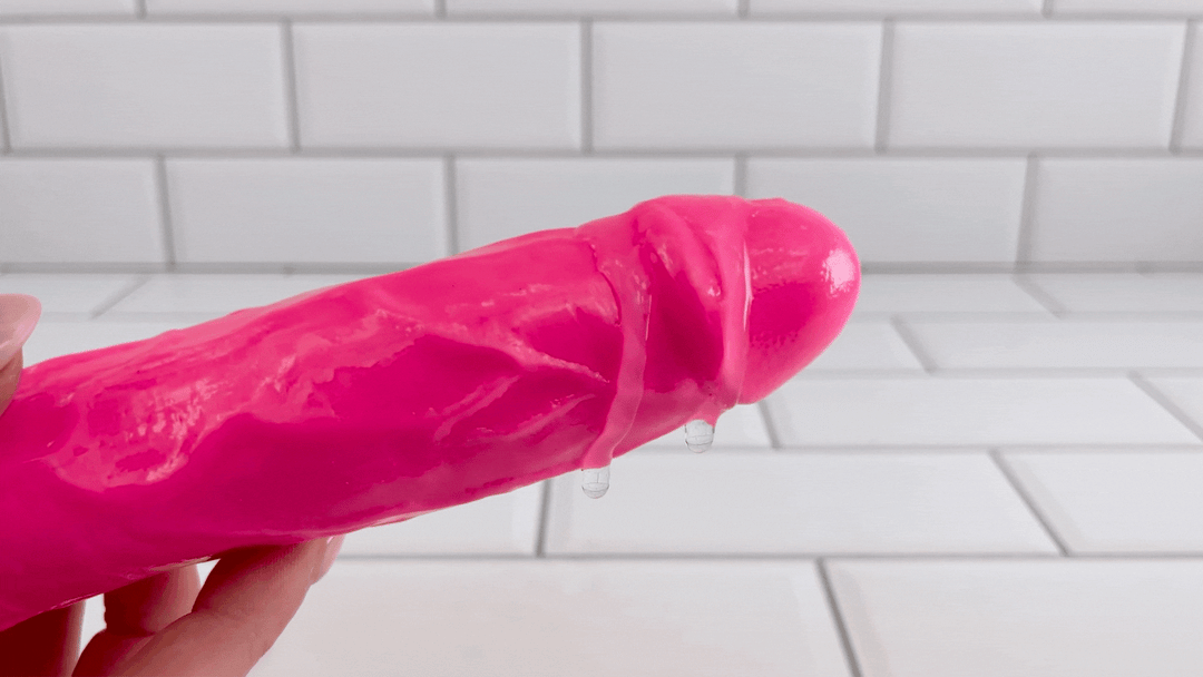 GIF of lubricant dripping off of Ultra Veined Realistic Vibrating Dildo from intense vibrations 