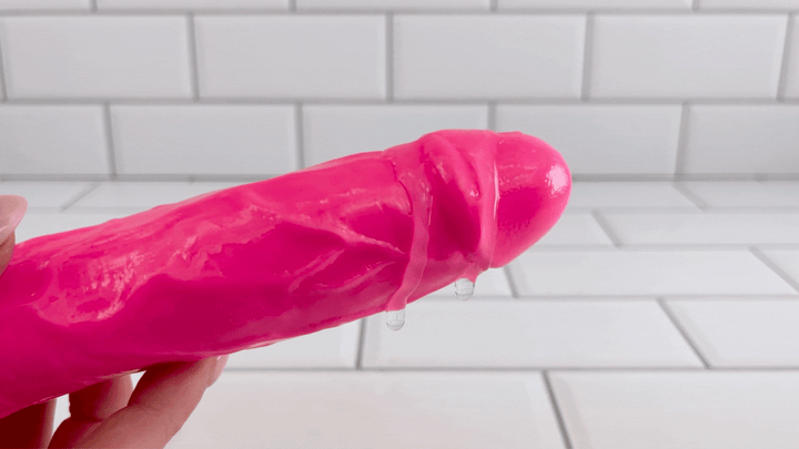 GIF of lubricant dripping off of Ultra Veined Realistic Vibrating Dildo from intense vibrations 