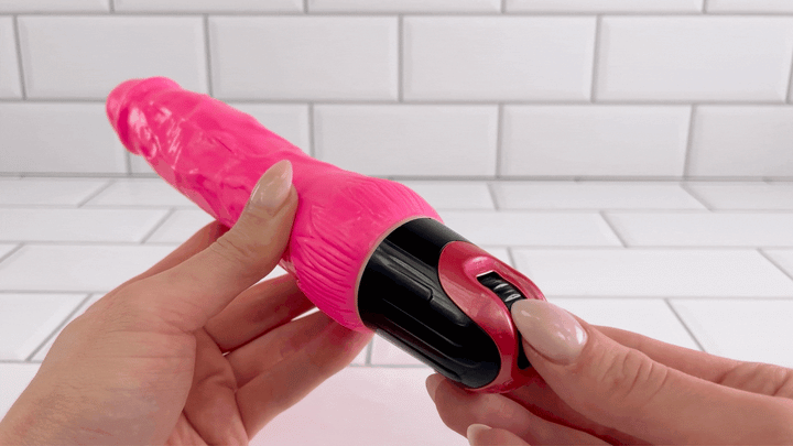 GIF of dial from Ultra Veined Realistic Vibrating Dildo being turned to power on device 