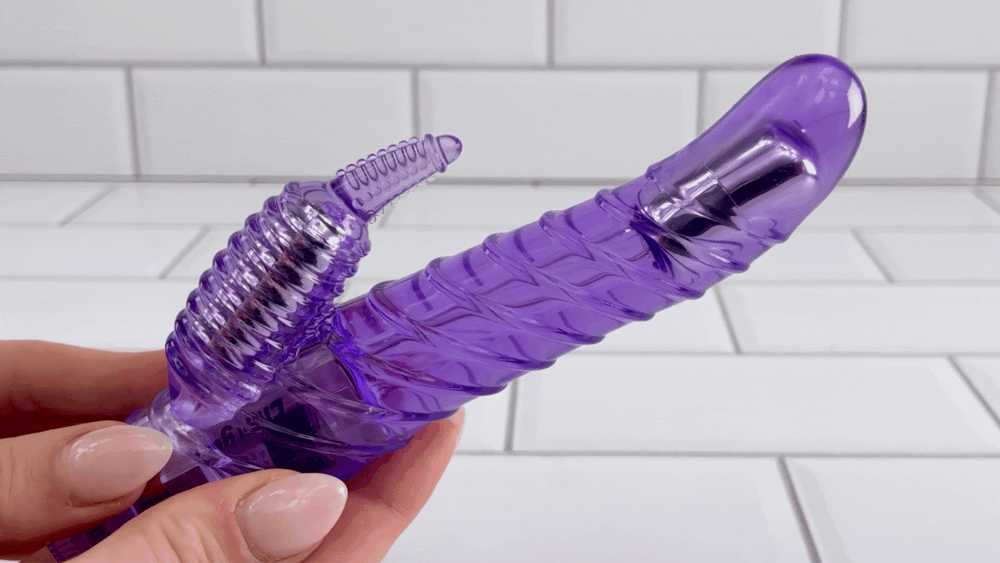 GIF of ribbed purple waterproof vibrator in full motion 