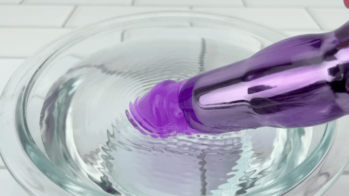GIF of shaft tip in bowl of water with vibration ripples Wonder Rabbit Dual Stimulator 
