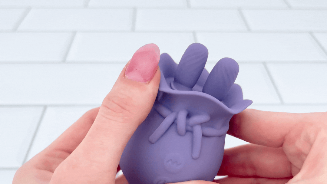 GIF of Lavender Lover Double Tongue Clit Licker flap being brushed against 