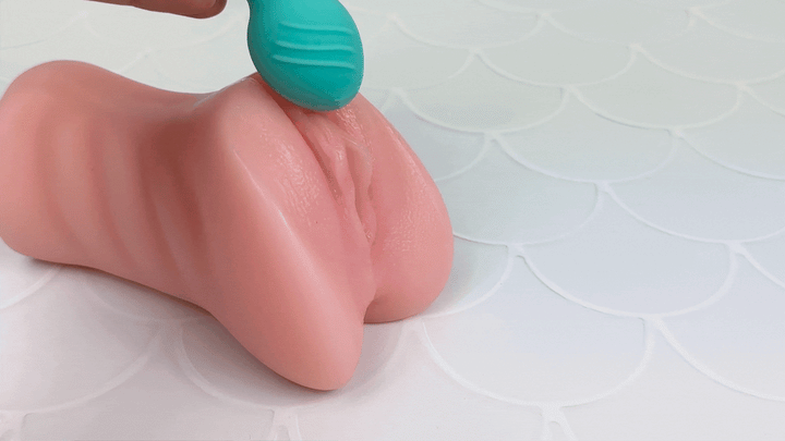 GIF showing kegel balls being used on a model of a vagina