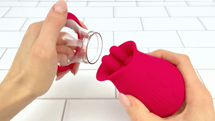 GIF of hands pulling off suction cup attachment from Up-Down Clit Sucking Vibrator 