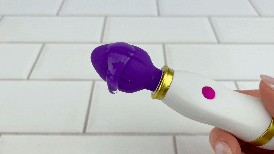 GIF of lubricant vibrating on head of Petite Handheld Clit Wand 
