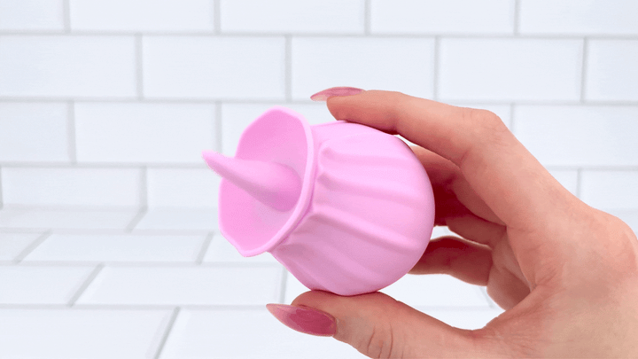 GIF of pink tongue flickering in a hand