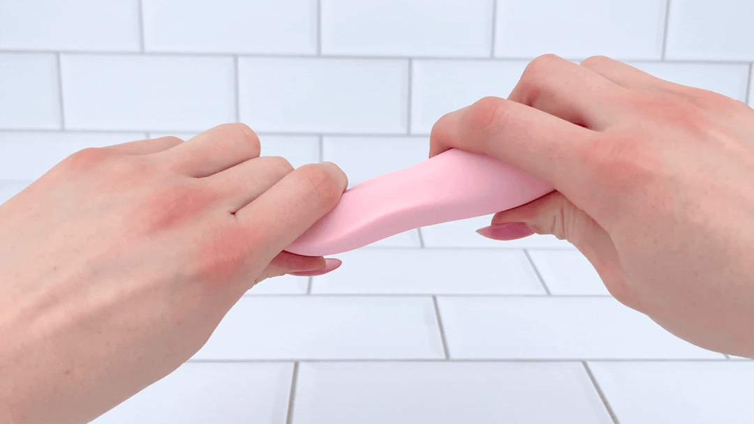GIF of Pique - Pinpoint Clit Vibrator being bent at neck to show flexibility 