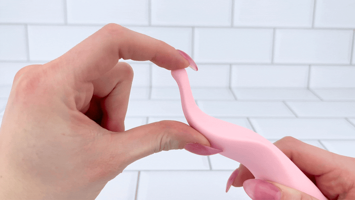 GIF of finger flexing Pique - Pinpoint Clit Vibrator tip 