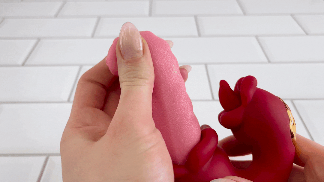 GIF of long tongue's tip from gyrating tongues toy being squished to show it's softness 