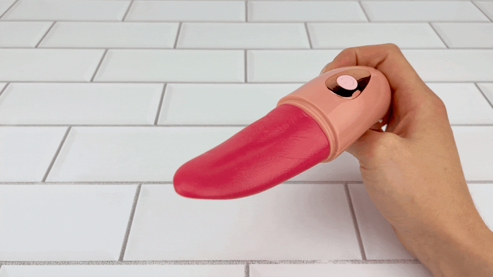 GIF topside view of Pink Rechargeable Licking Tongue textured soft tongue 