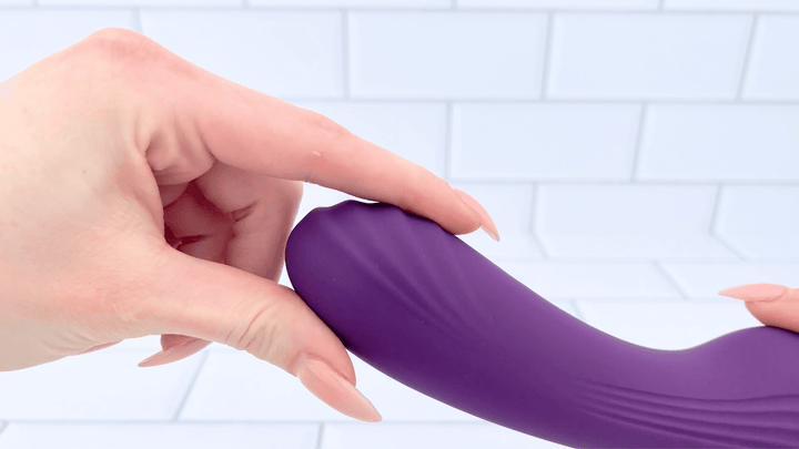 GIF of finger brushing against ridges from Ultimate Tongue Licker Powerful Dual-Ended Vibrator and Sucking Tongue g-spot shaft 