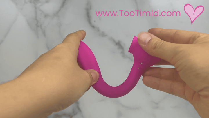 GIF of pink bendable clit licking g spot vibrating toy showing flexibility