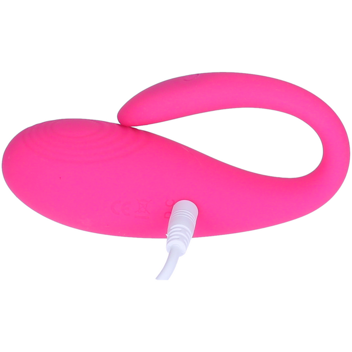 view of wearable vibrator plugged into charger