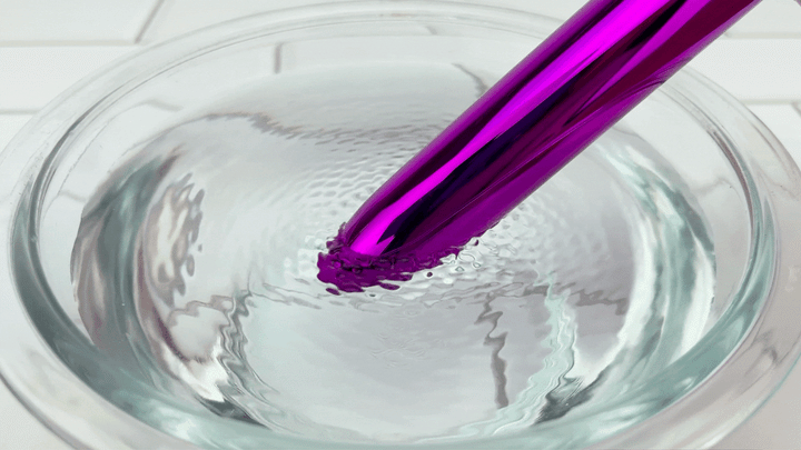 GIF of lube vibrating on quickest setting in bowl of water 