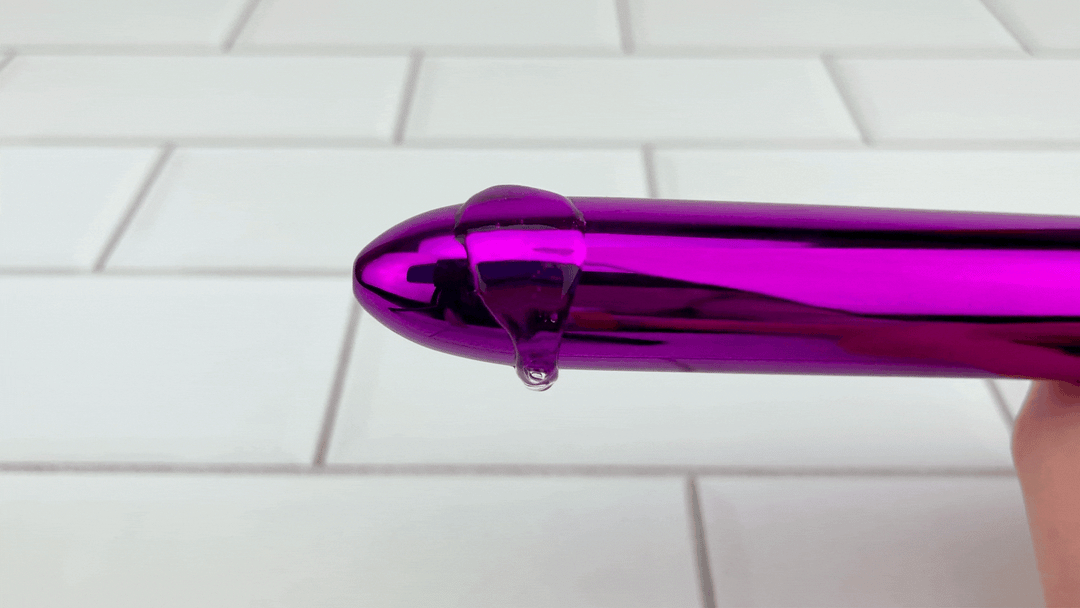 GIF of Sleek Pinpoint Vibrator with lube vibrating intensely off of it 