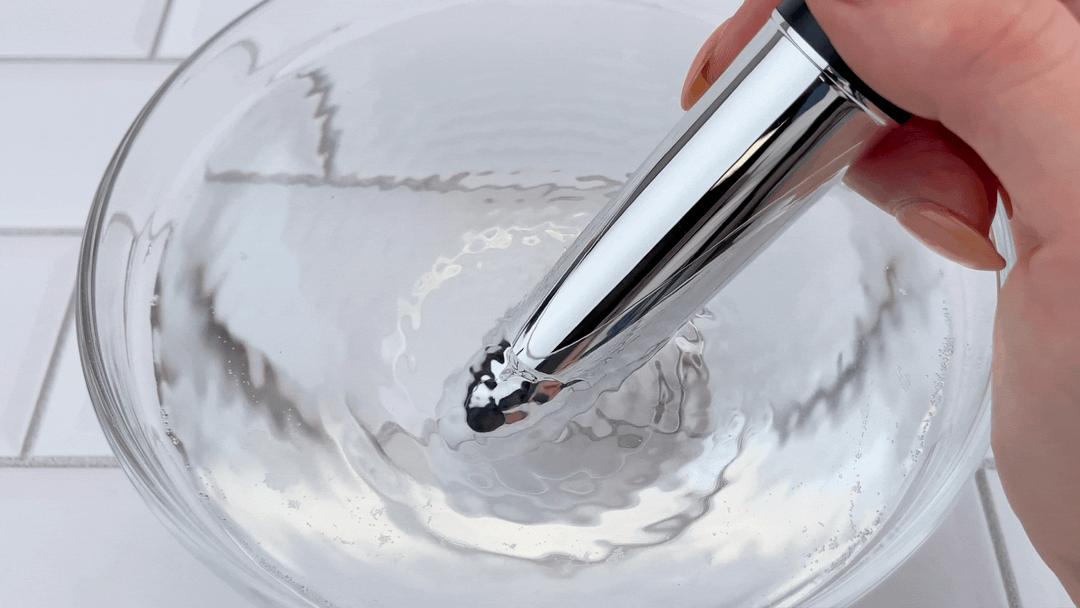 GIF of medium sized bullet vibrating in bowl of water