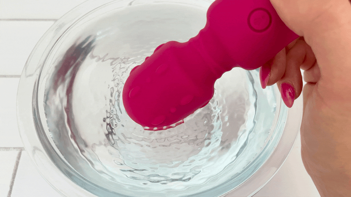 GIF of head from Textured Wand Massager vibrating in bowl of water 