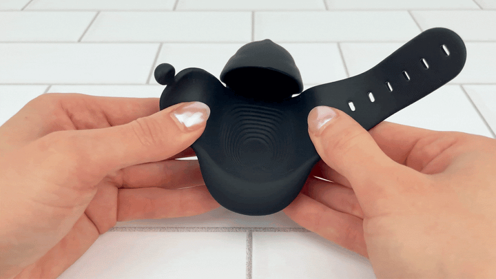 GIF of flapsfrom Wearable Hands-Free Vibrating Masturbator being moved to show soft silicone