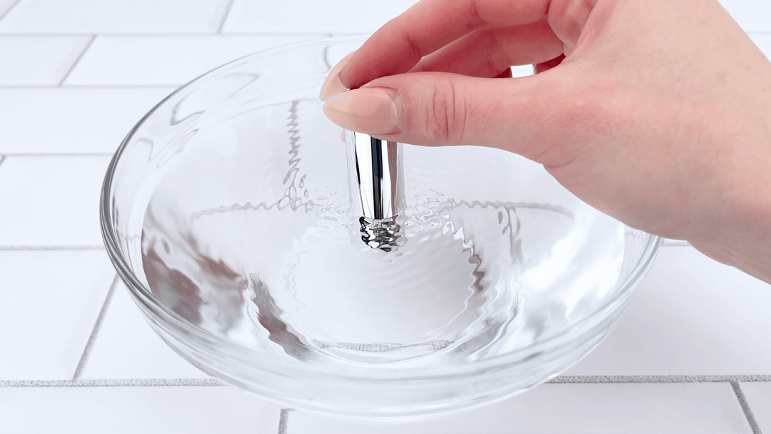 waterproof bullet vibrator from Silicone Vibrating Cock Ring with Raised Ticklers used on bowl of water 