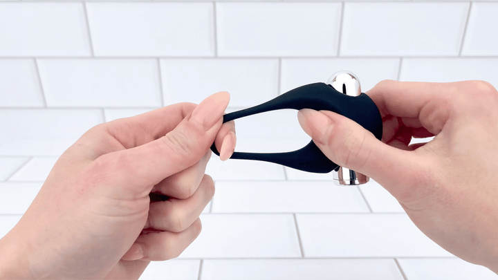 GIF of Silicone Vibrating Cock Ring with Raised Ticklers being stretched to show flexibility 