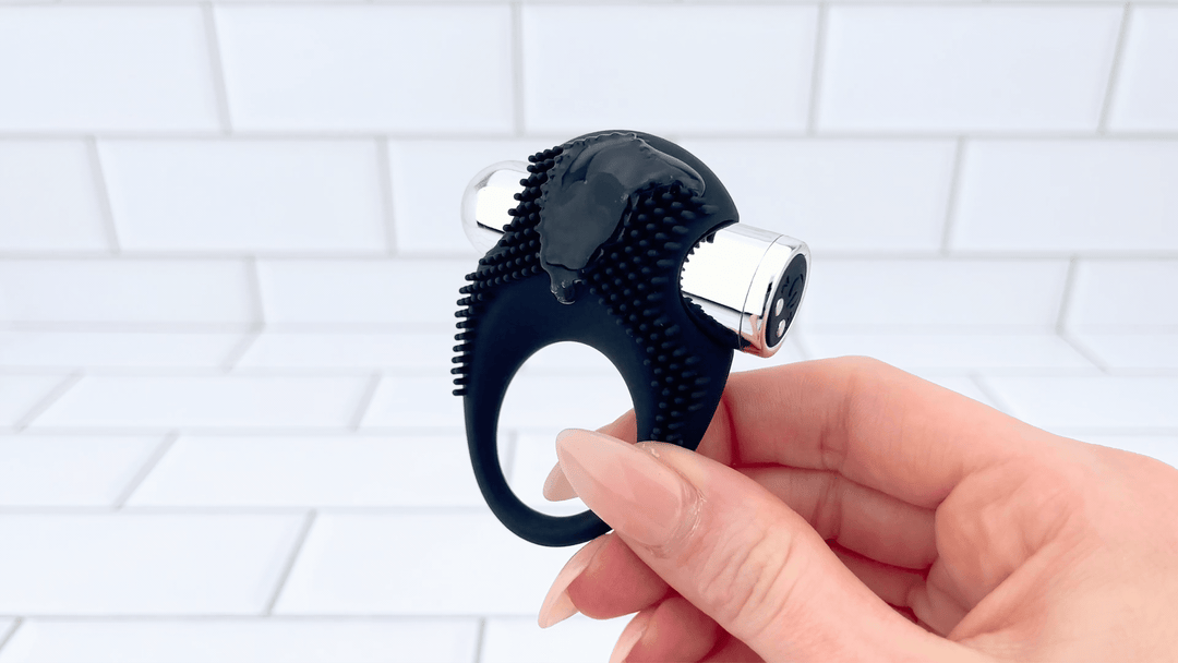 GIF of Silicone Vibrating Cock Ring with Raised Ticklers with lube vibrating on it 