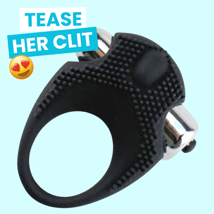 Black and silver clitoral ring with text 'TEASE HER CLIT' on a light blue background