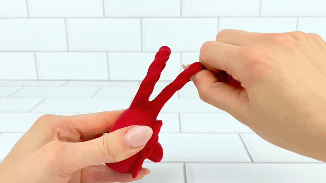 GIF of cock ring being stretched from Twirling Tongue Flower Silicone C-Ring