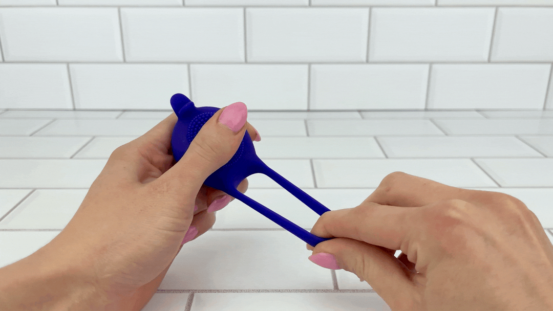 GIF of loop from Silicone Clit Stimulating Vibrating Cock Ring For Couples being stretched 