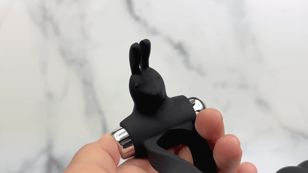 GIF of rabbit ears on DP cock ring vibrating