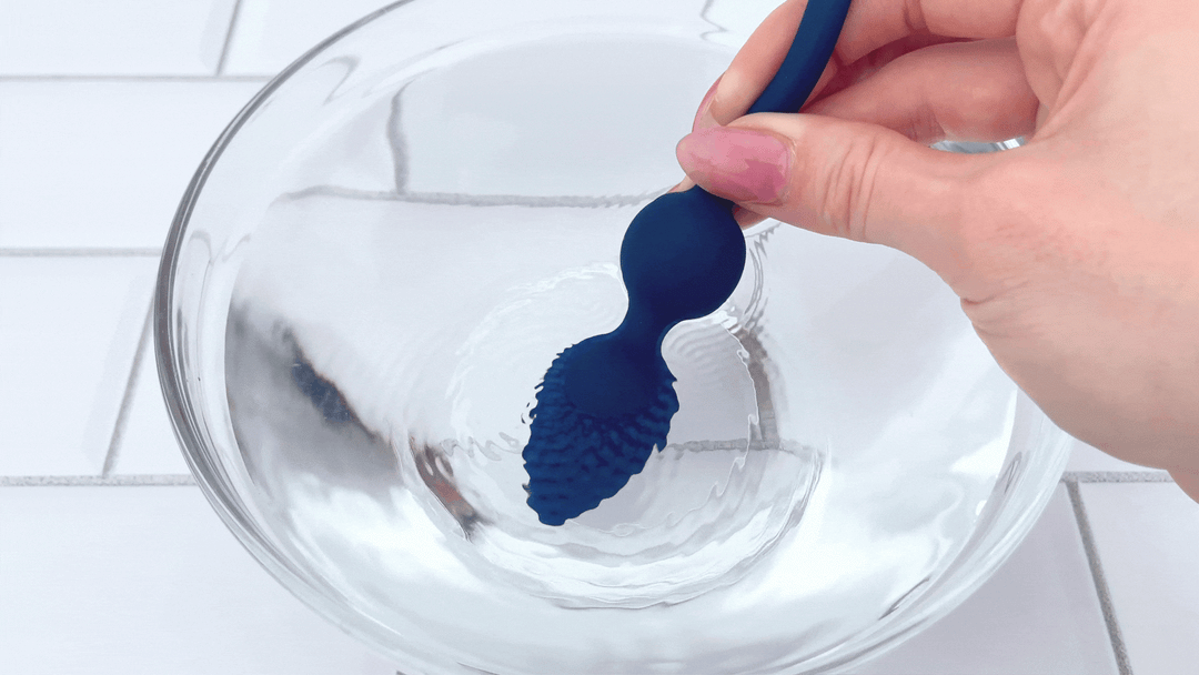 GIF of anal plug from Cock Ring with Ball Cage and Anal Plug vibrating in bowl of water 
