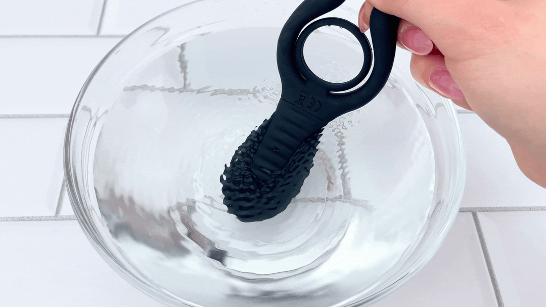 GIF of clit stimulator from The Dual-Action Clit and Ball Vibrating Cock Ring vibrating in bowl of water 