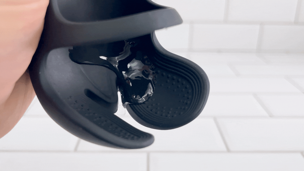 GIF of lubricant dripping off o vibrating Laska Remote Cock and Ball Vibrator 