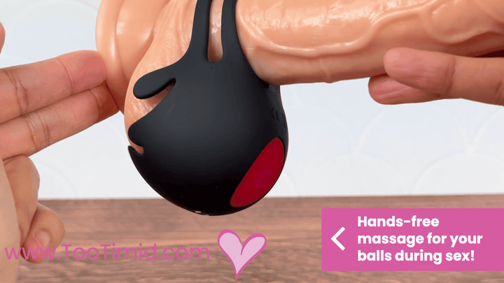 GIF of black ball vibrator and cock ring vibrating on beige dildo close up of ball view