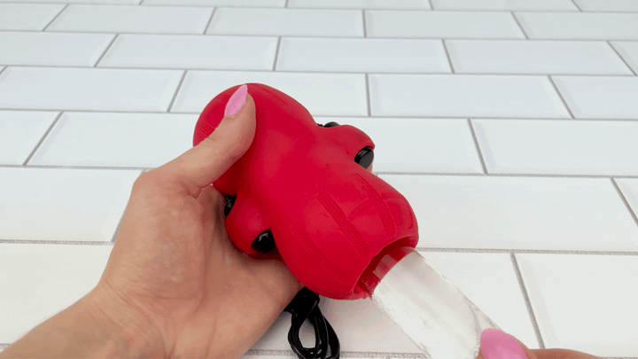 GIF of glass dildo thrusting inside Bello Male Vibrating Masturbator vibrating at full strength