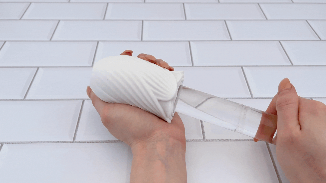 GIF of glass dildo sliding into Jolie Rose Bud Masturbator