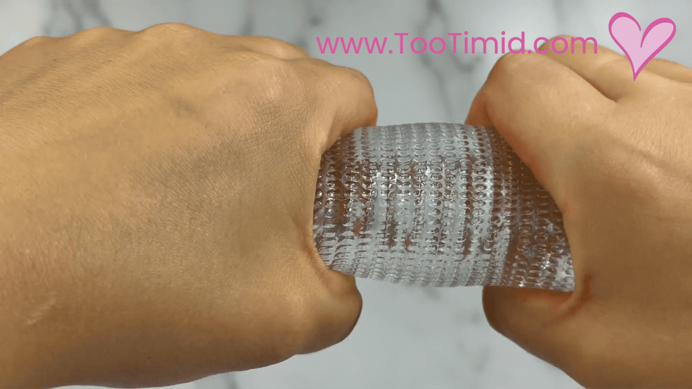 GIF of clear male masturbator being stretched by hand