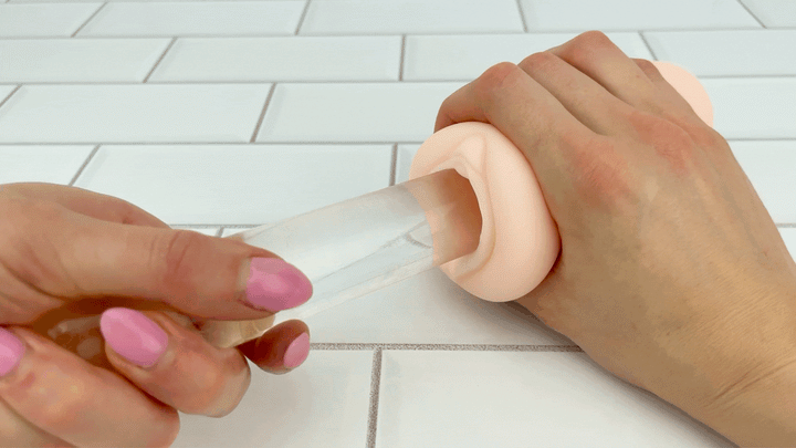 GIF of glass dildo being inserted inside well lubed Fantasy Love Male Stroker 