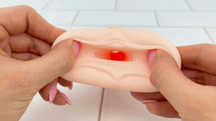 GIF of Fantasy Love Male Stroker entry hole being stretched to show soft material 
