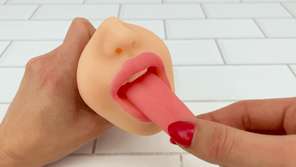 GIF of long tongue from Ultimate Deep Throat Dual Stroker being pulled 