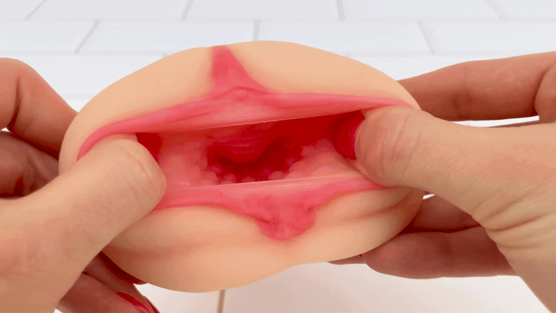 GIF of realistic vagina from realistic male masturbator being stretched open  