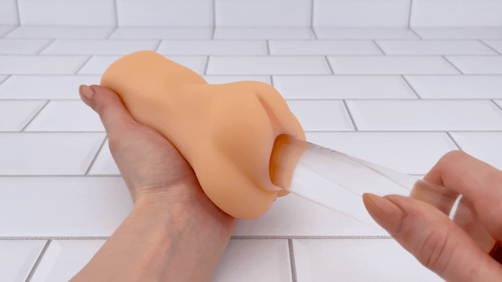 GIF of glass dildo sliding into Easy Grip Tight and Realistic Pocket Pussy 