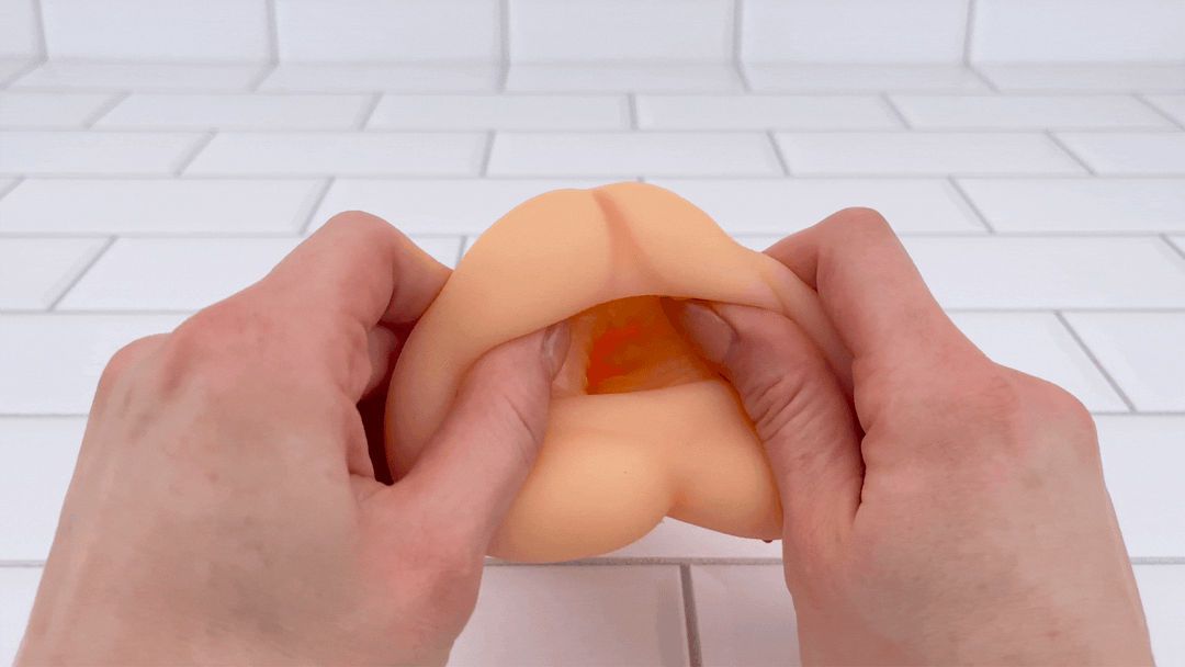 GIF of opening from Easy Grip Tight & Realistic Pocket Pussy being stretched 