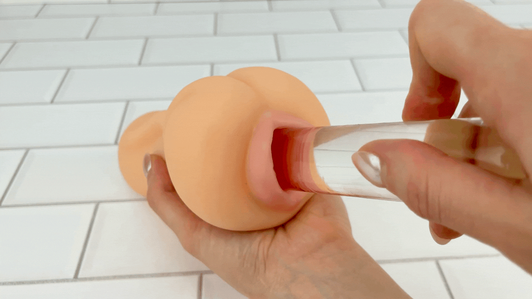 GIF of glass wand thrusting into well lubricated Ultra Real Feel Pussy Stroker 