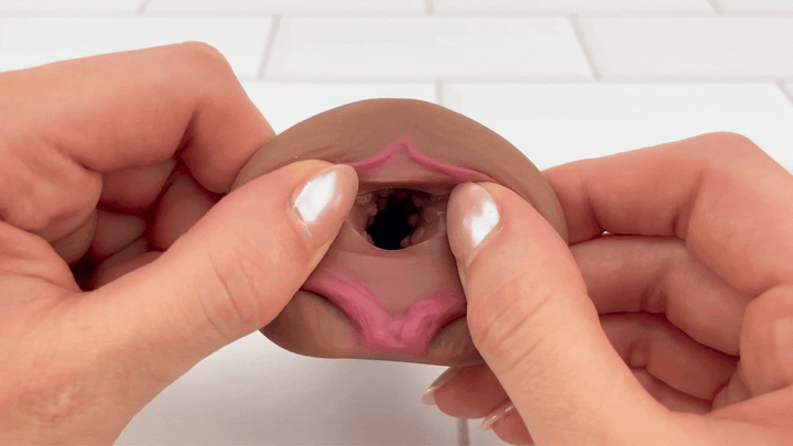 GIF of GIF of Realistic Pocket Pussy Male Stroker opening being stretched to show interior 
