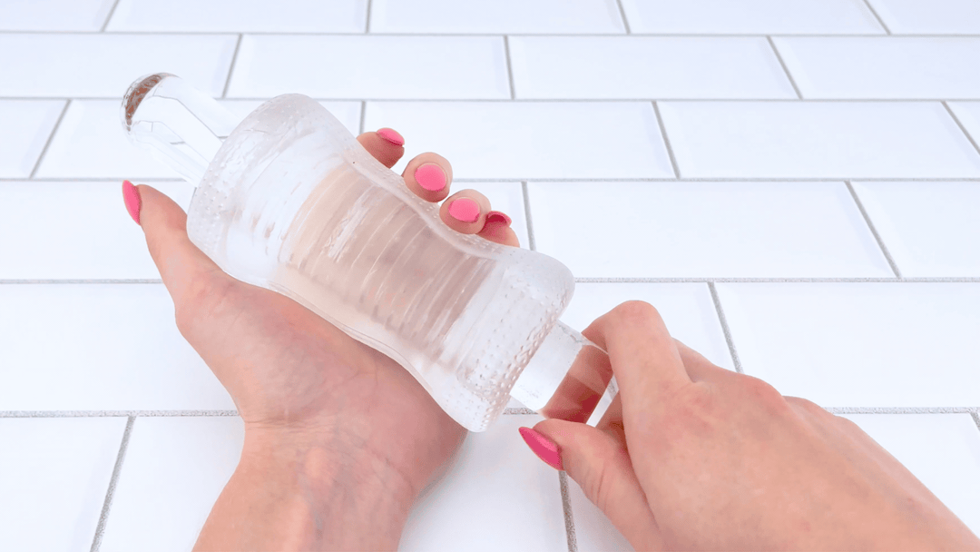GIf of glass dildo sliding into Super Stretchy Clear Ribbed Male Masturbator