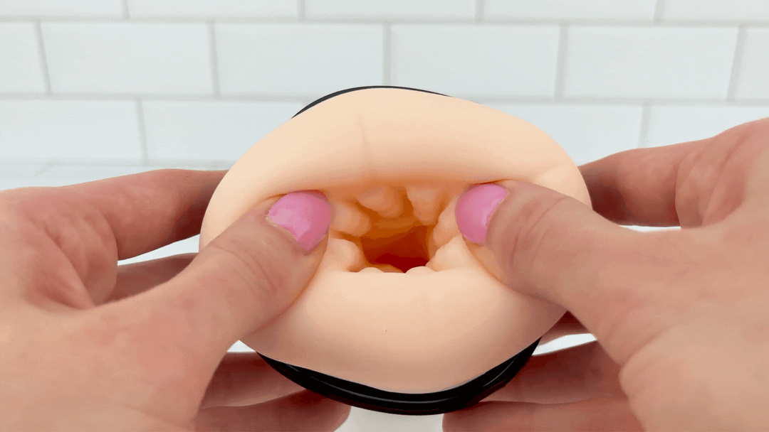 GIF of The Angel Vibrating & Heating Masturbator - opening being stretched to show pleasure nubs vibrating 