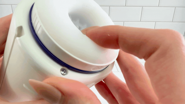 GIF of thumb pressing against opening of Super Series Adjustable Length Masturbator 