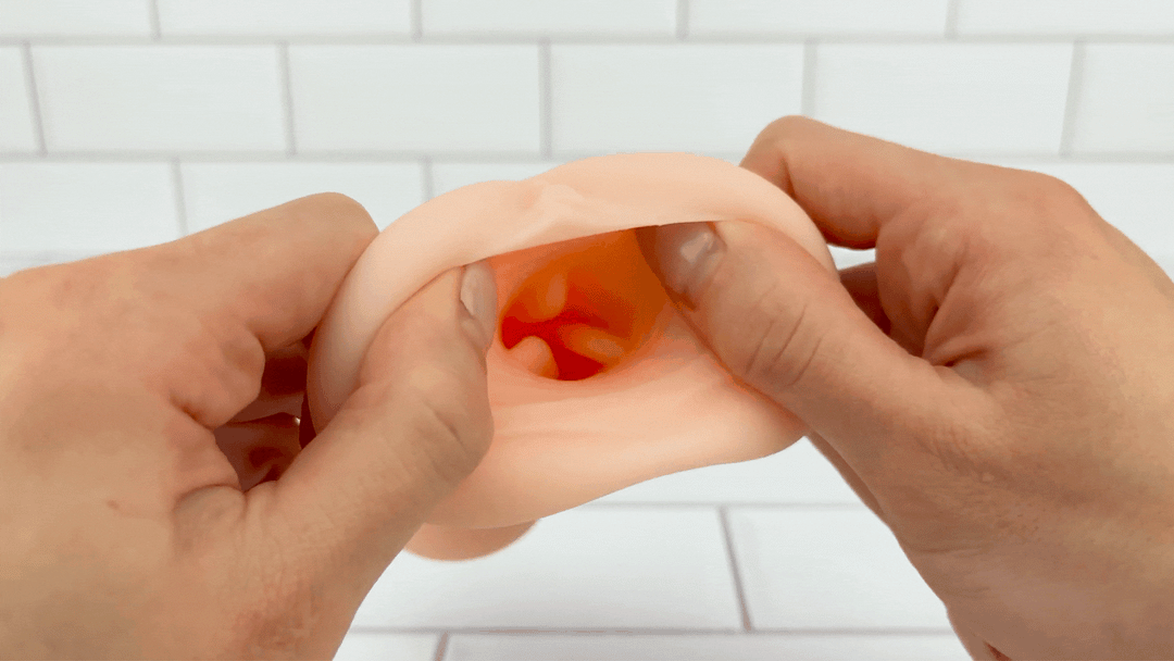 GIF of realistic opening from Realistic Handheld Stroker being stretched 