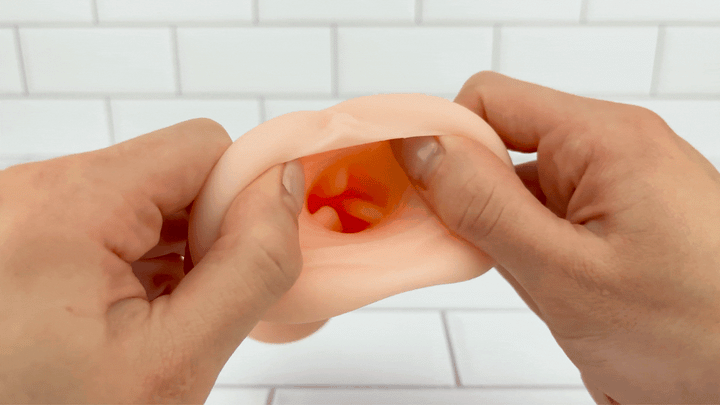 GIF of realistic opening from Realistic Handheld Stroker being stretched 