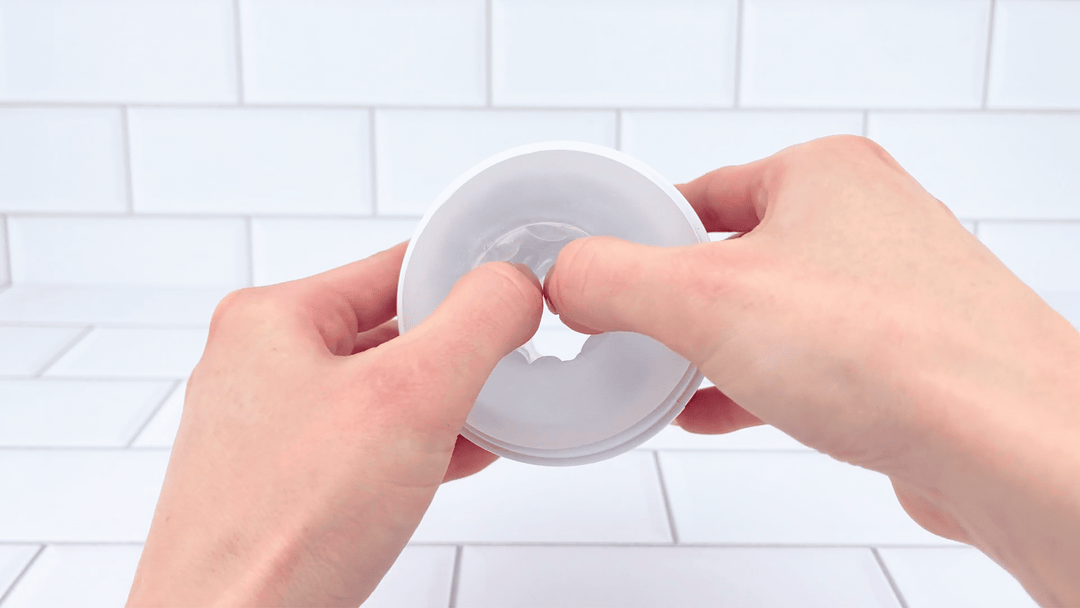 GIF of Open-Ended Vibrating Male Masturbator jelly sleeve being stretched 